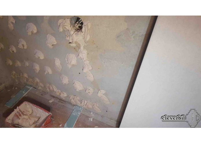 Gluing drywall to the wall with mounting adhesive